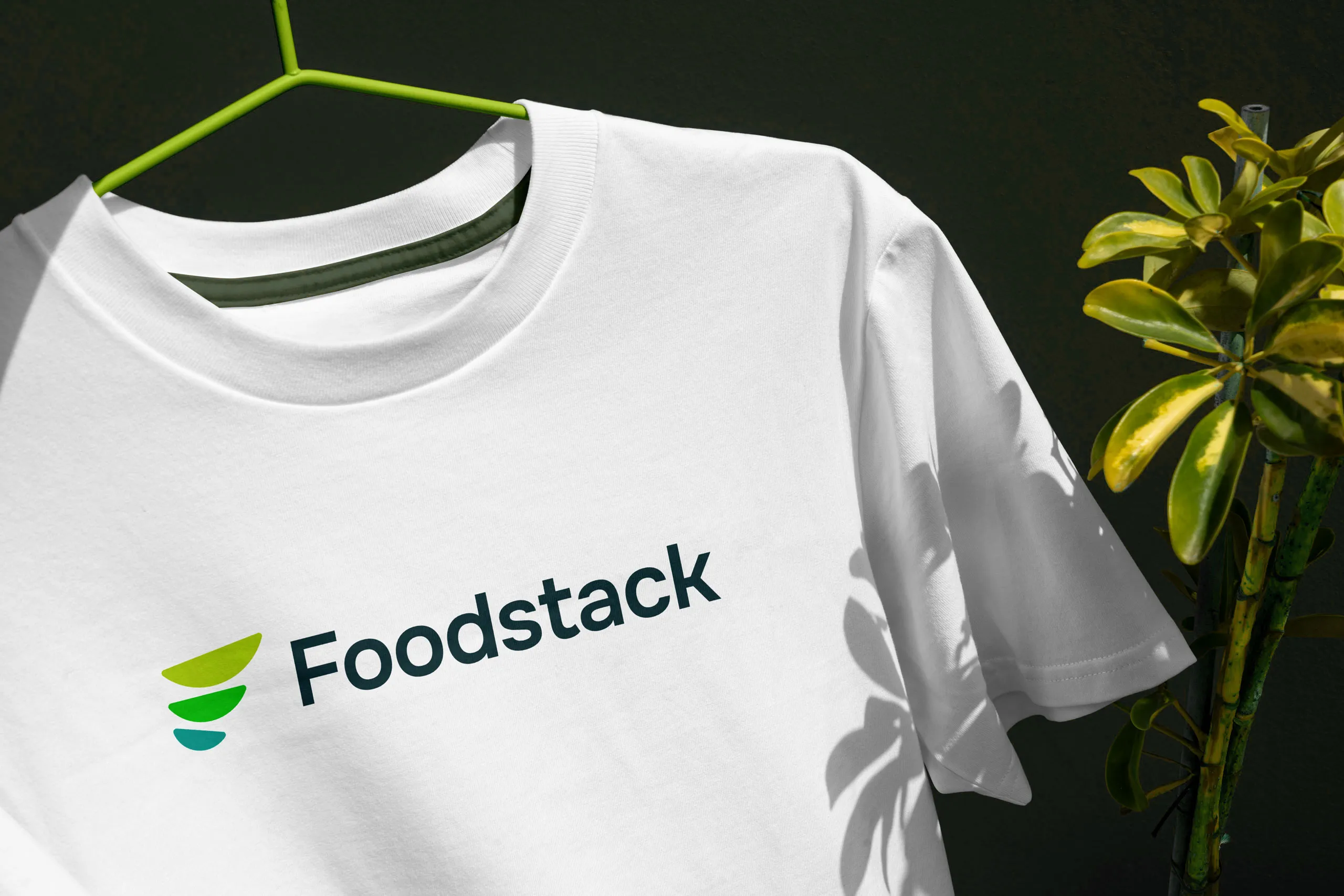 Mockup of the Foodstack logo on outdoor apparel, showing the brand in action.