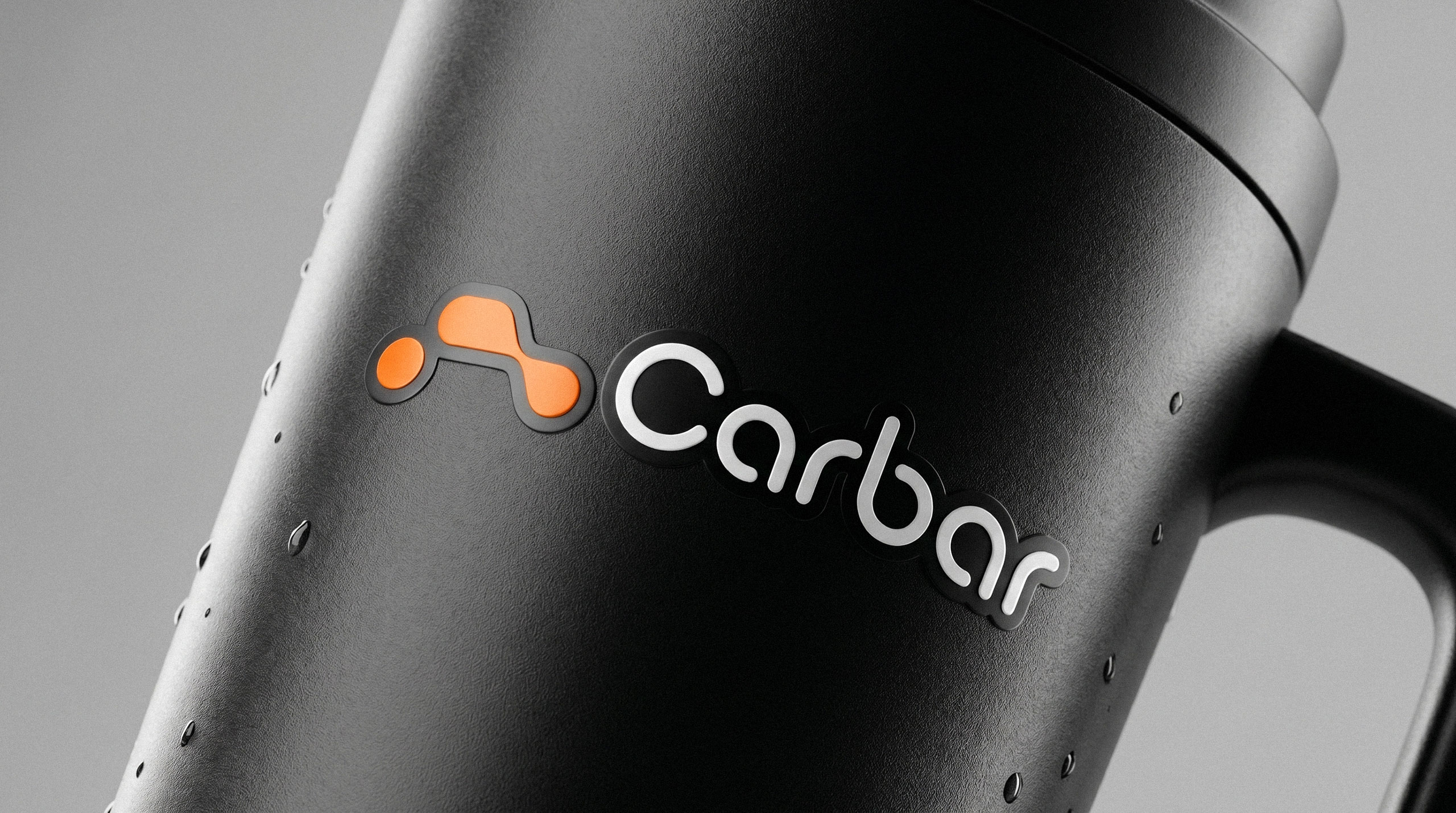 Matte black insulated travel mug displaying the Carbar logo with water droplets on the surface - design by Brandforma Studio.