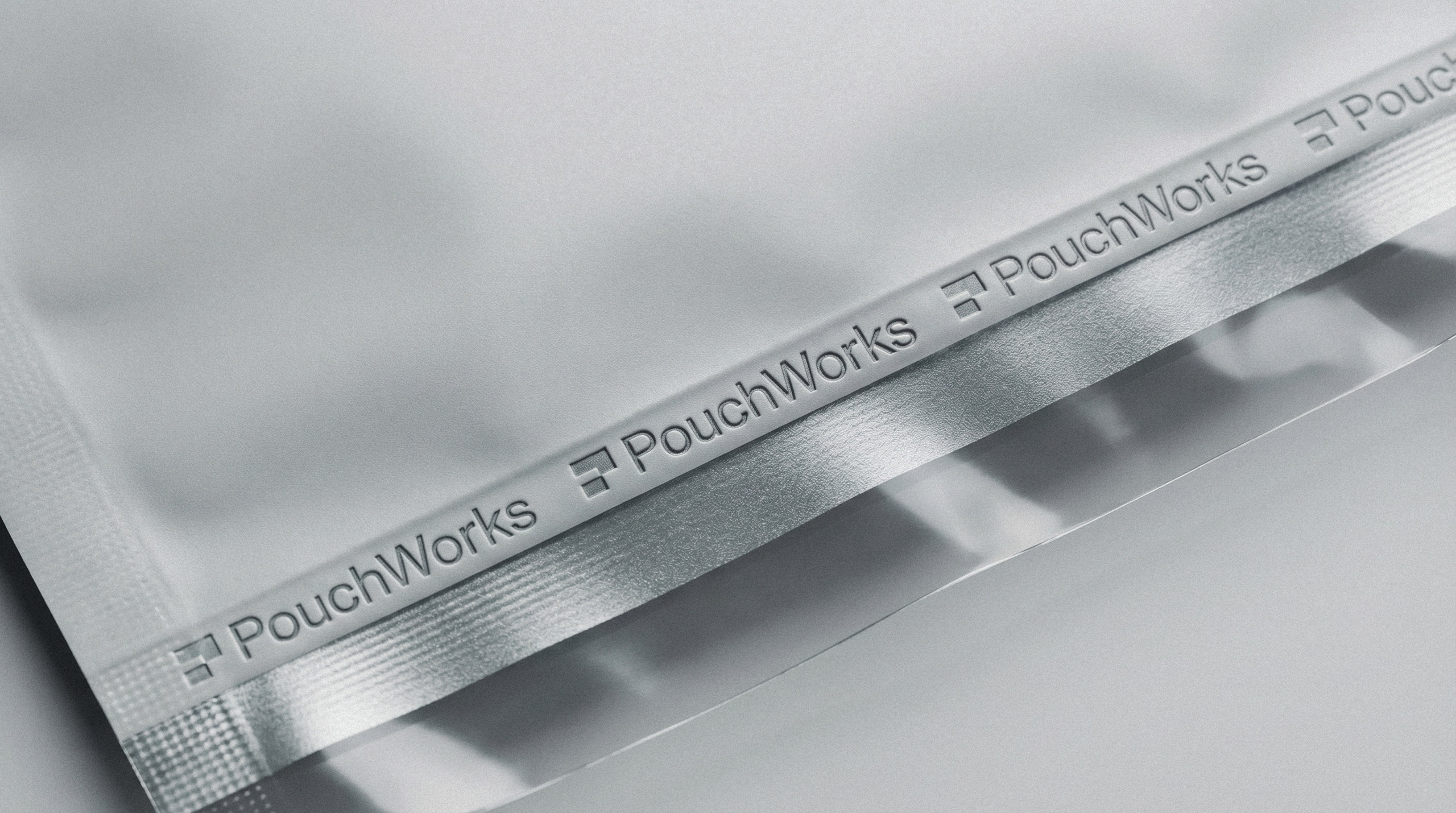Close up shot of repeating logo printed on the zip seal of a flexible packaging pouch by Brandforma Studio