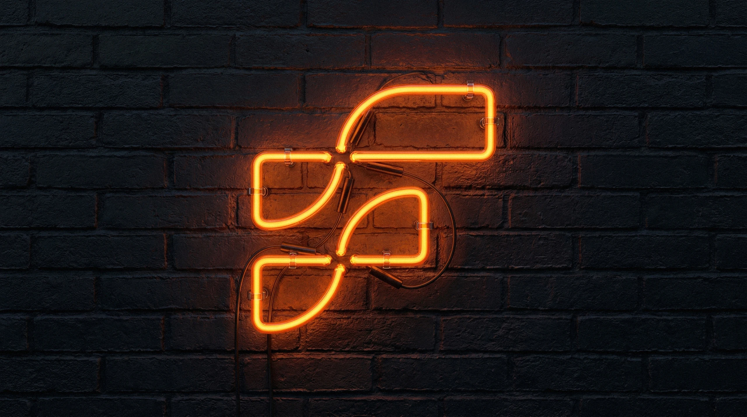FirstMotion F symbol rendered as a glowing orange neon sign on a dark brick wall
